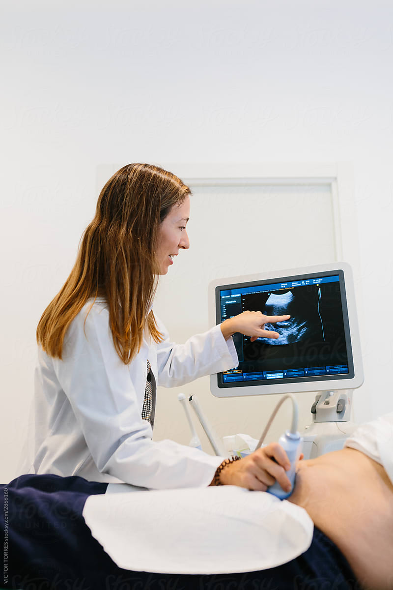 Female doctor performing an ultrasound to a patient