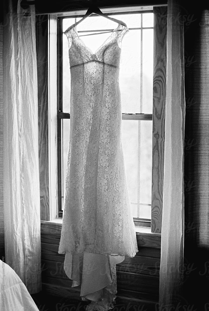 Wedding Dress Hanging in Window
