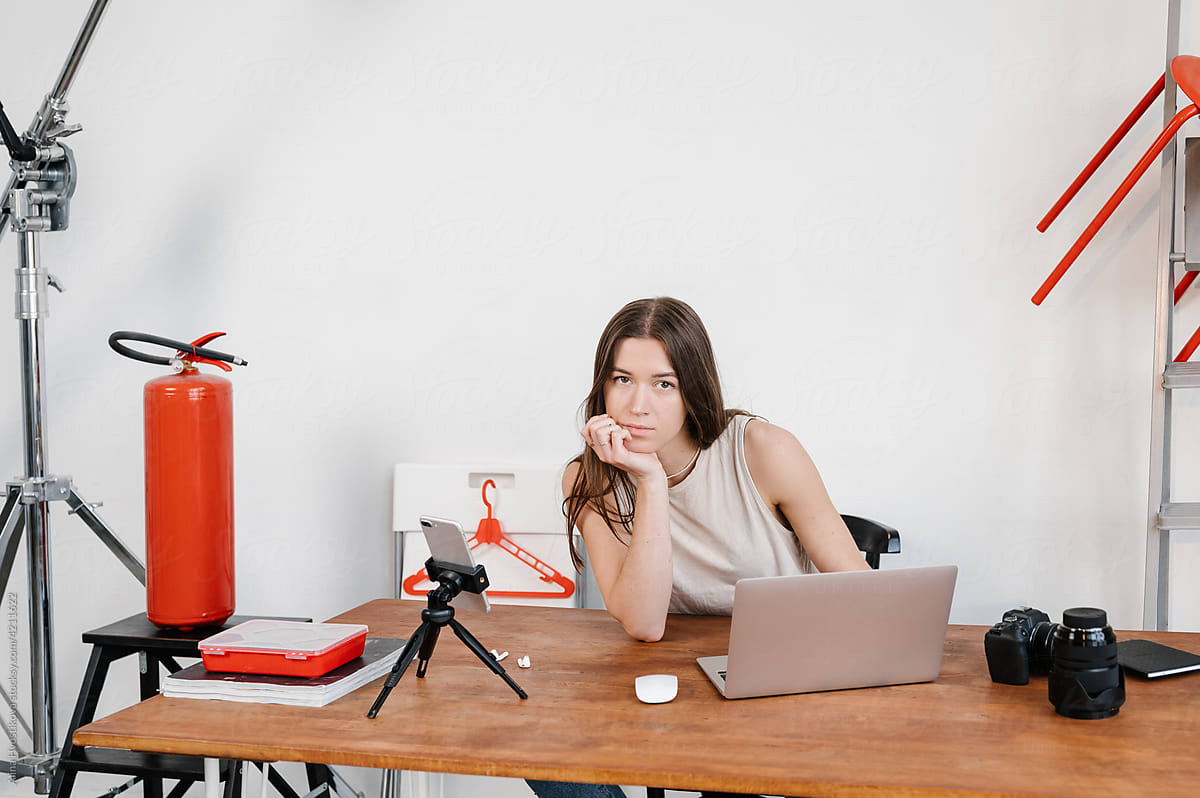 Woman Sitting At Desk With Laptop by Stocksy Contributor Alina