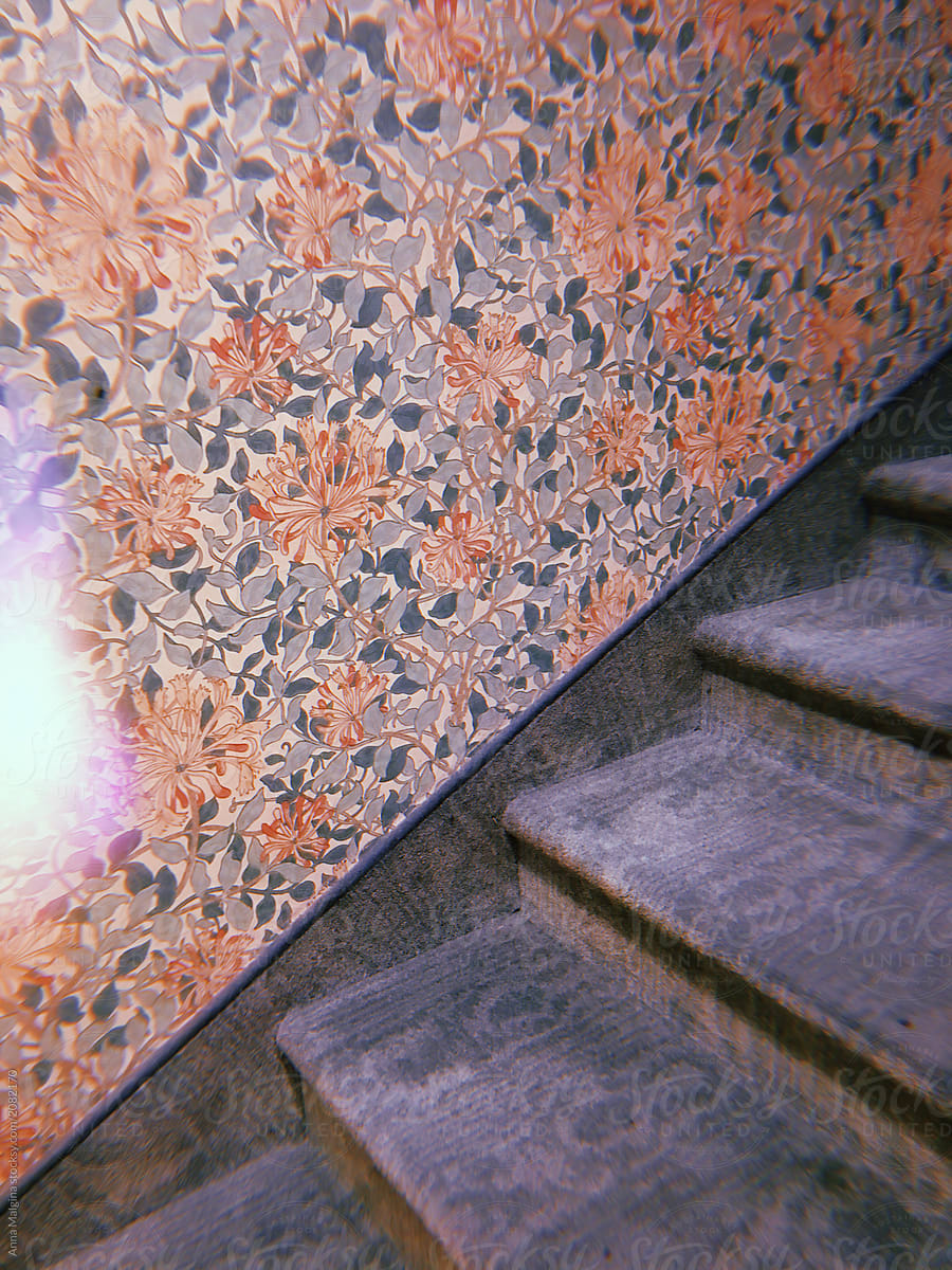 Vintage Staircase With Floral Wallpaper and Carpet