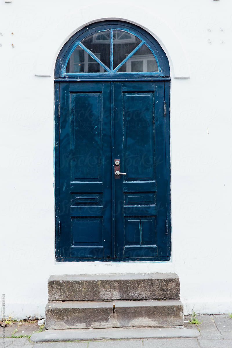 Blue arched door in Reykjavík, Iceland