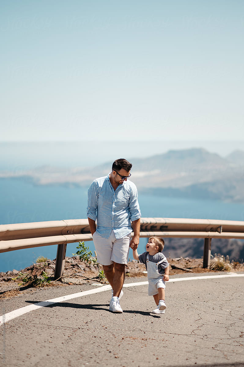 Dad walking with son.