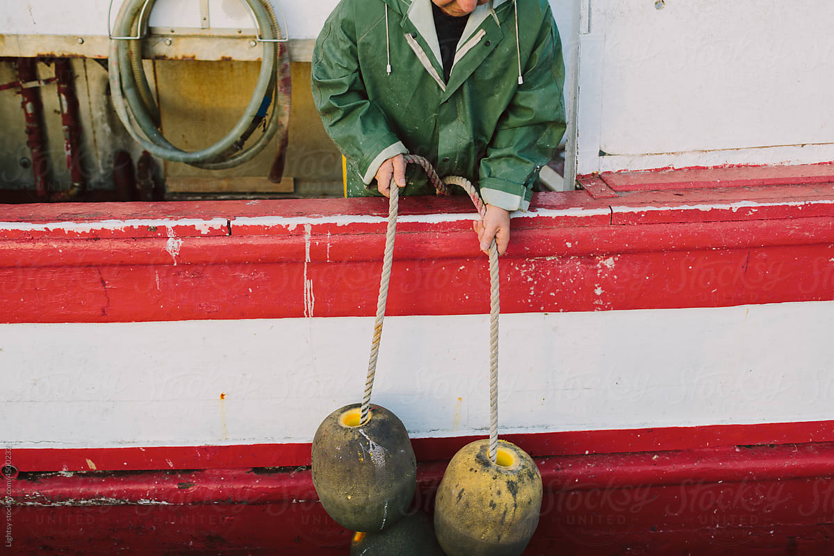 Unknown fisherman preparing a boat