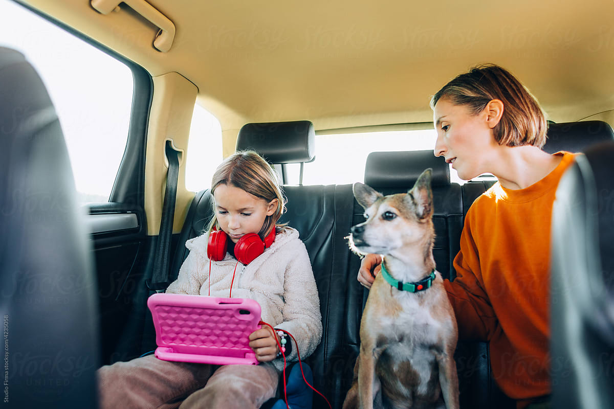Woman, Little Girl and Dog in Car