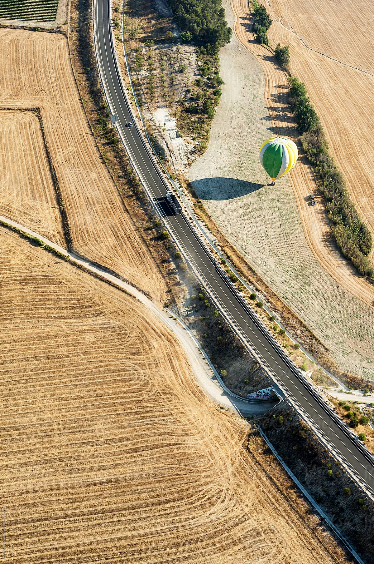 Hot air balloon landing on a wheat field,Igualada, Spain