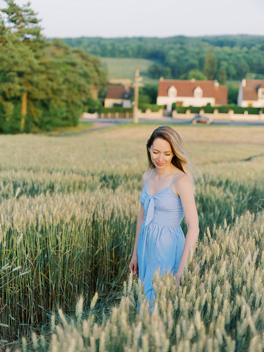 Portrait Of a Woman On Wheat Field
