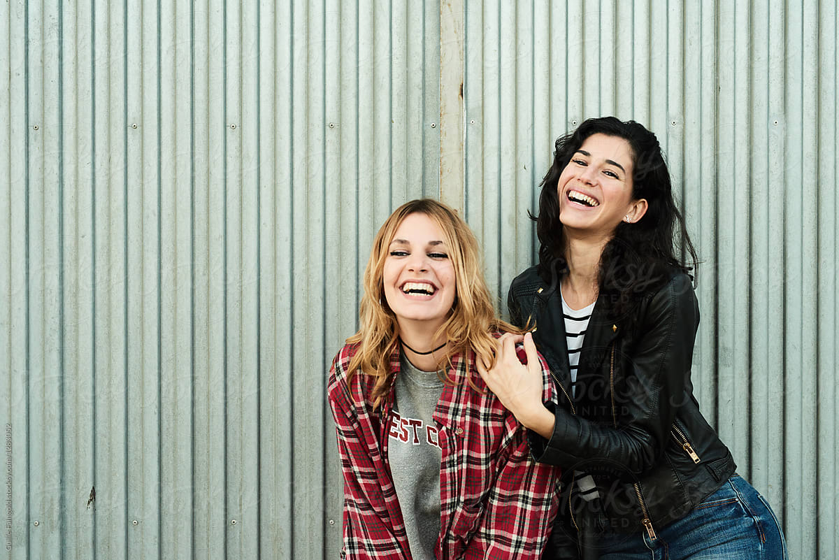 Laughing girlfriends.