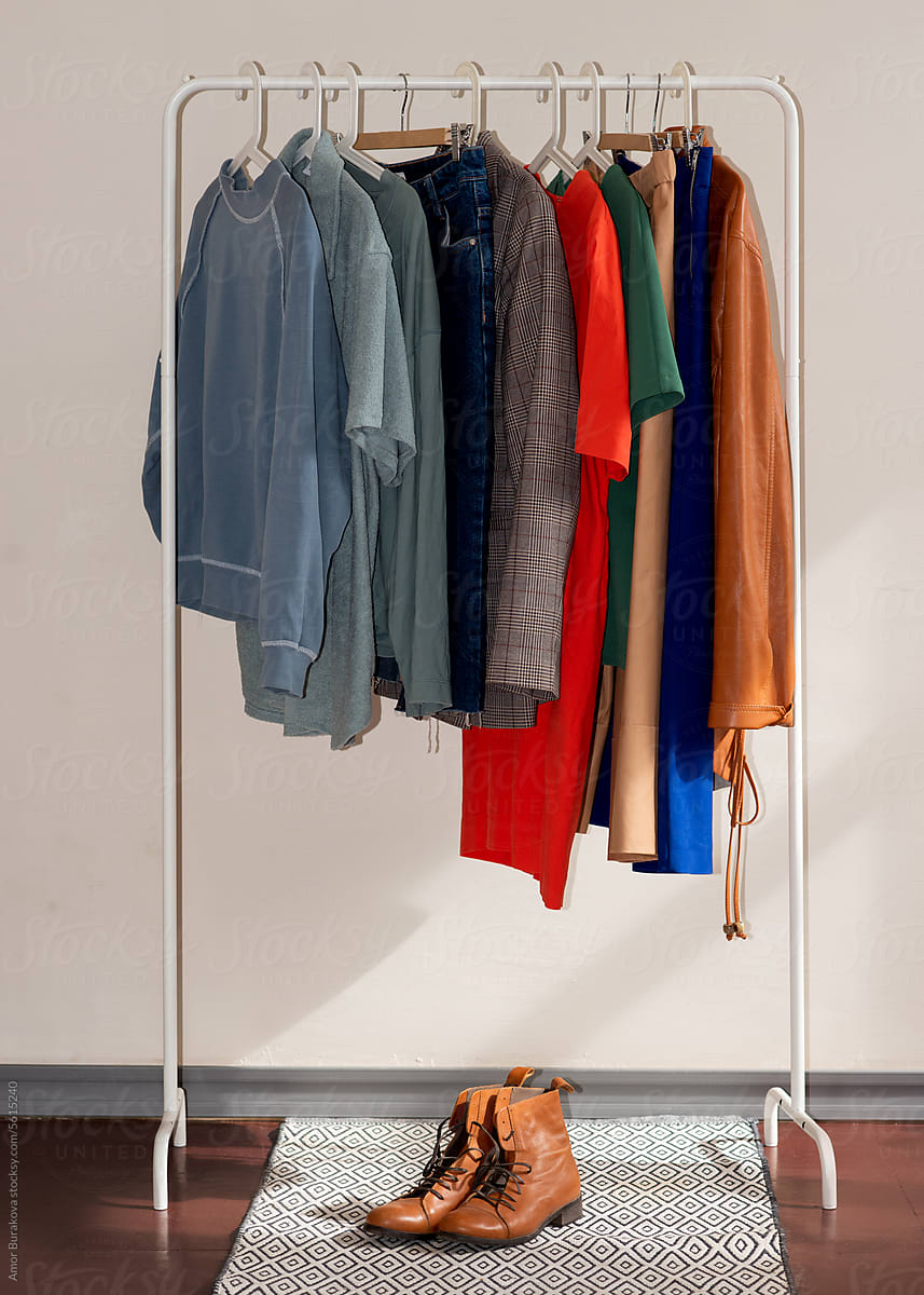 Colorful bright clothes hanging on the rack