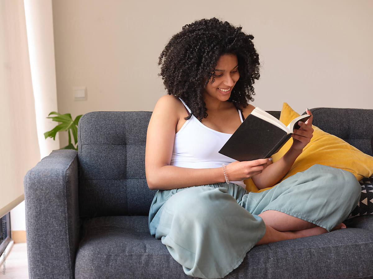 Smiling reading Black woman.