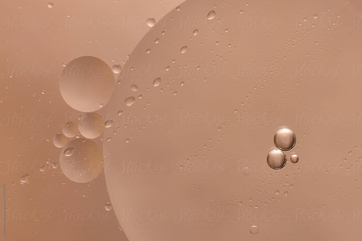 macro image of beauty serum with pink background