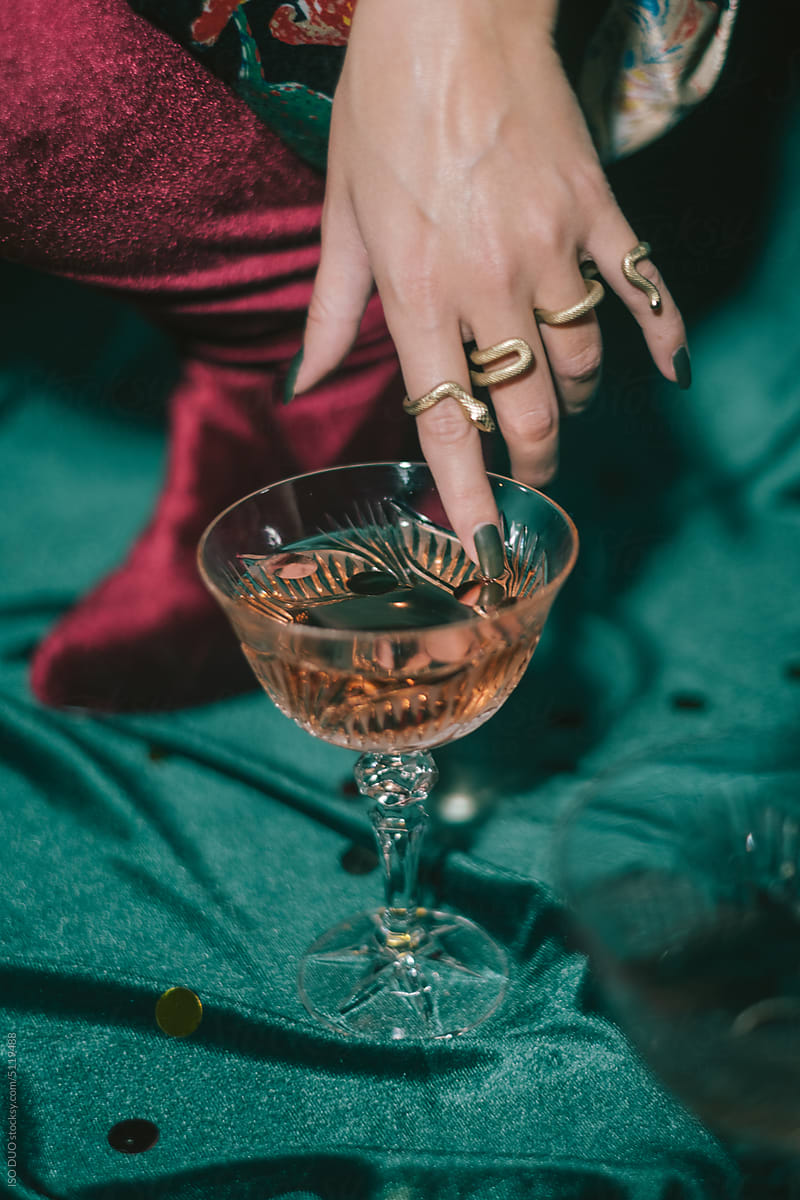 Women hand touching wine glass