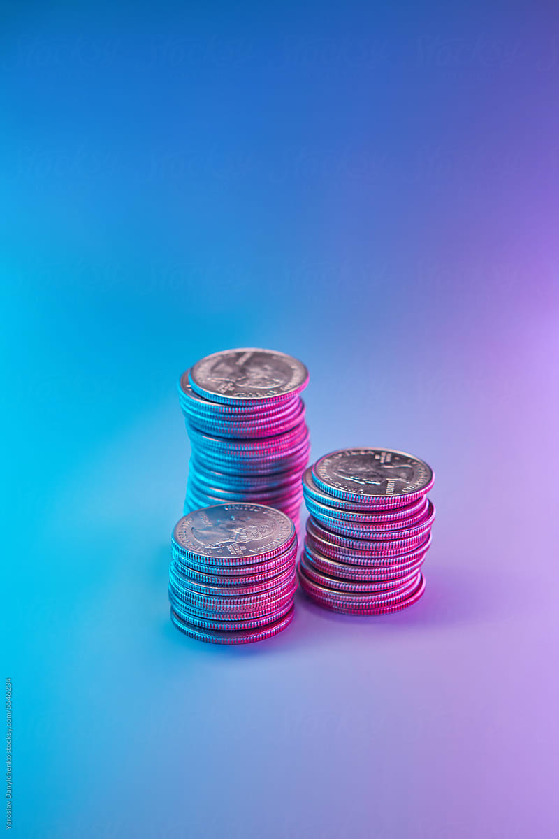 Cent coins against multicolored background.