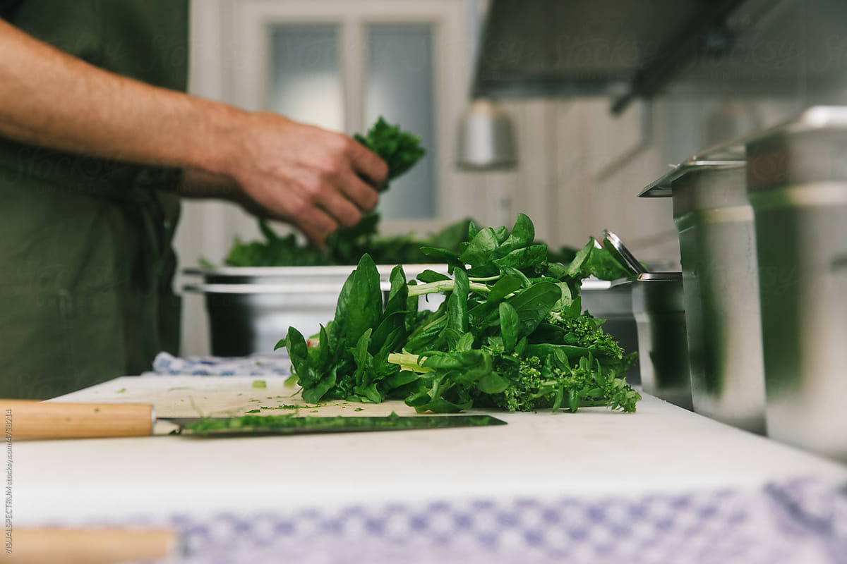 Unrecognizable Chef Preparing Fresh Spinach