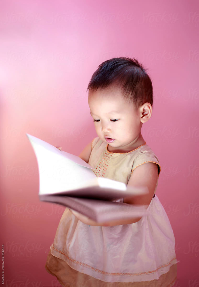 little asian baby reading