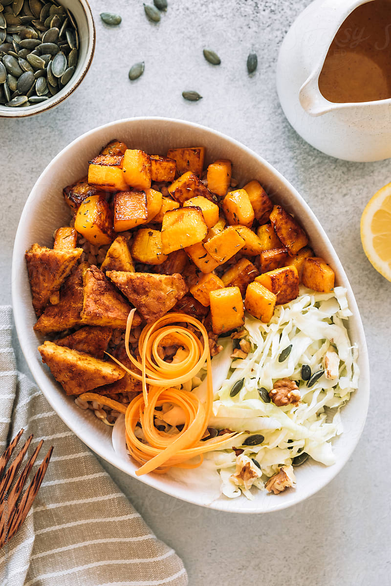 Sauteed pumpkin with spicy tempeh and fresh salad