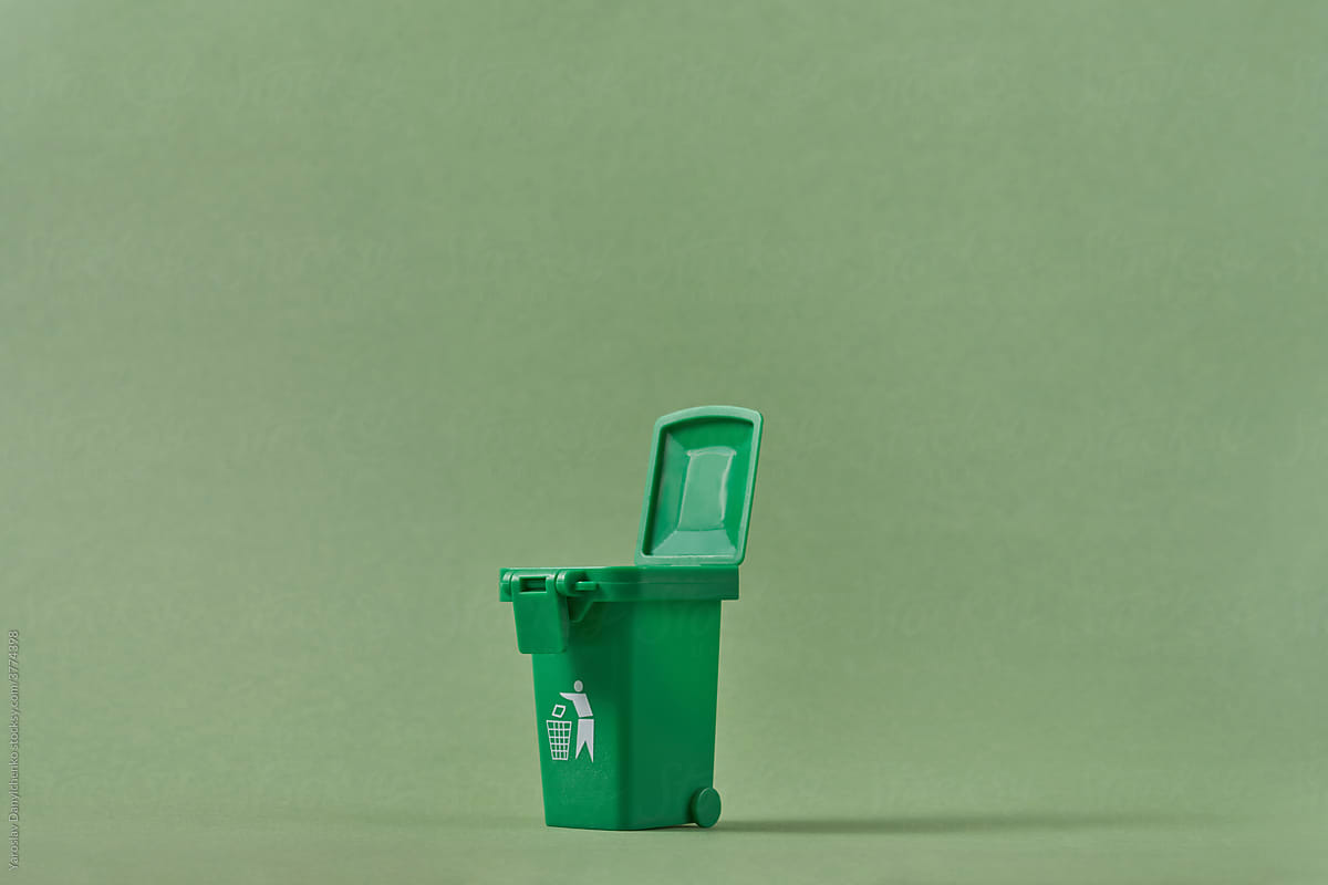 Small open green trash can for recycling