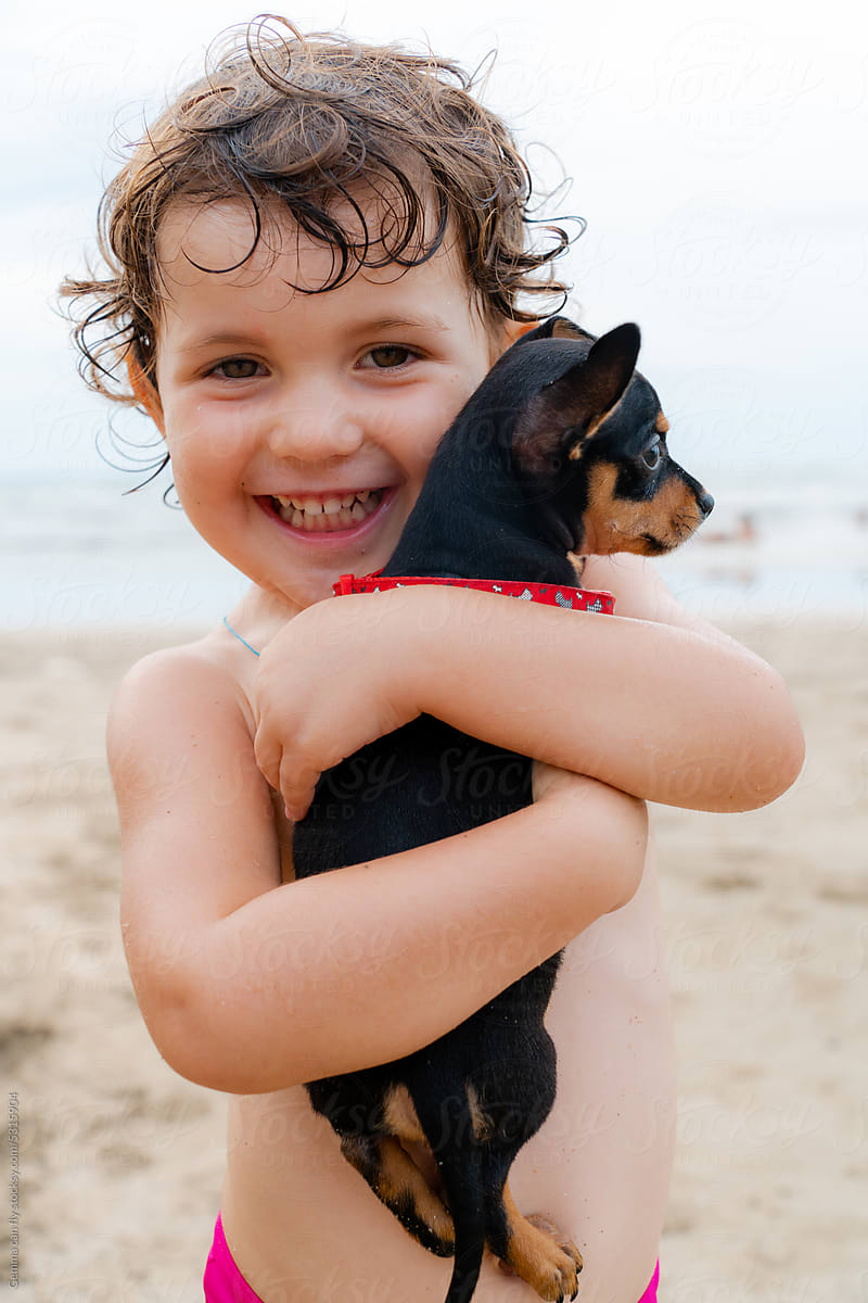 Animal lover kid girl with chihuahua dog.