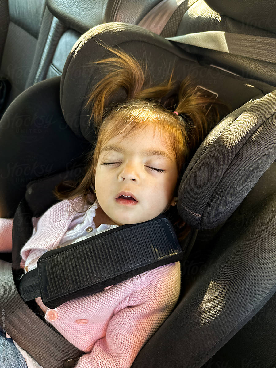 baby asleep in car seat
