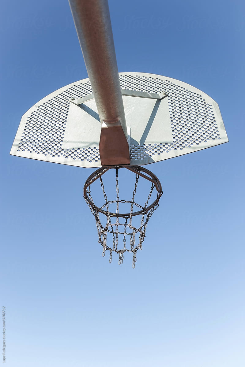 basketball basket with a sky in the background
