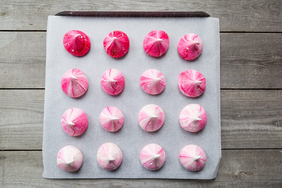 Ombre Pink meringue kisses on baking sheet