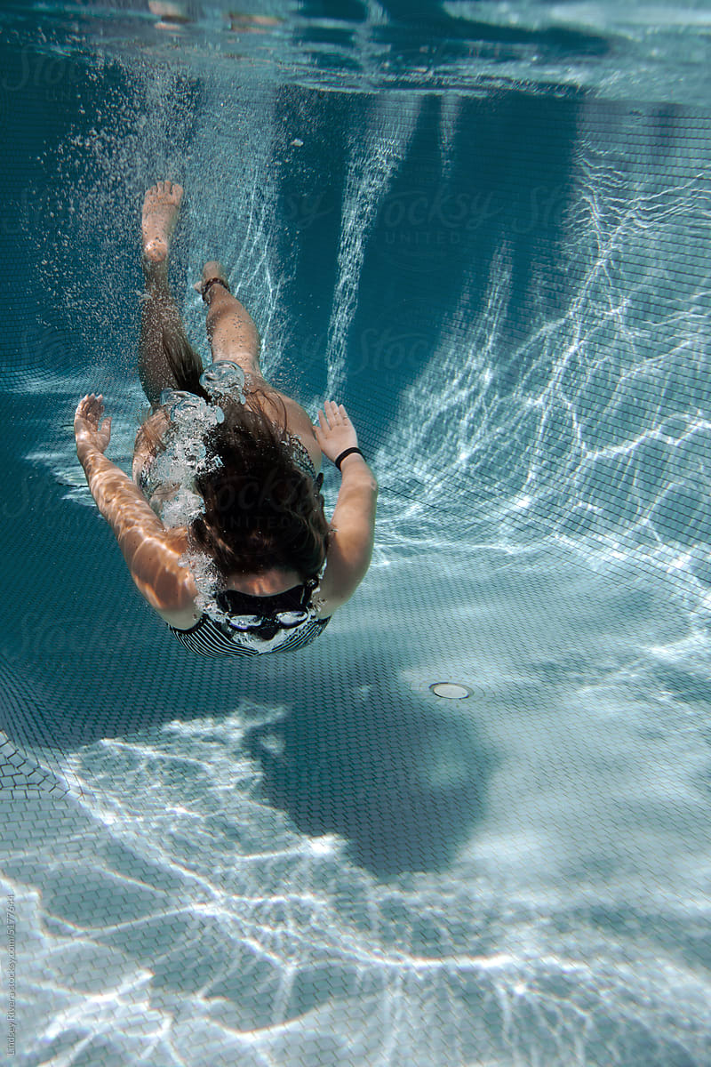 Woman Swimming Peacefully Underwater