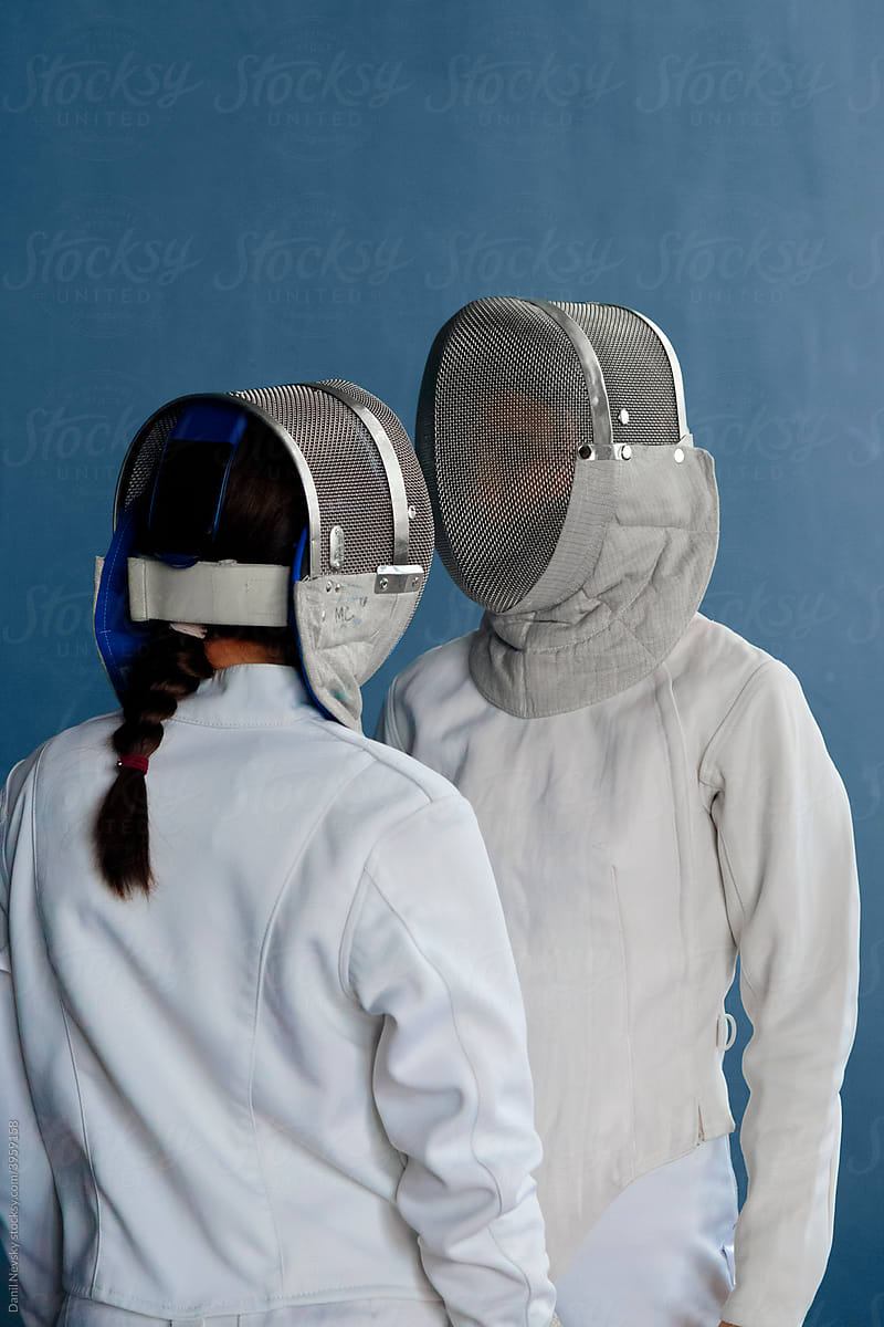 Female fencers looking at each other