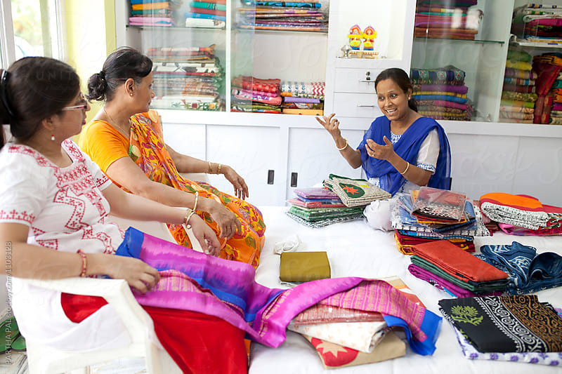 A Businesswoman deals with her client in a small shop