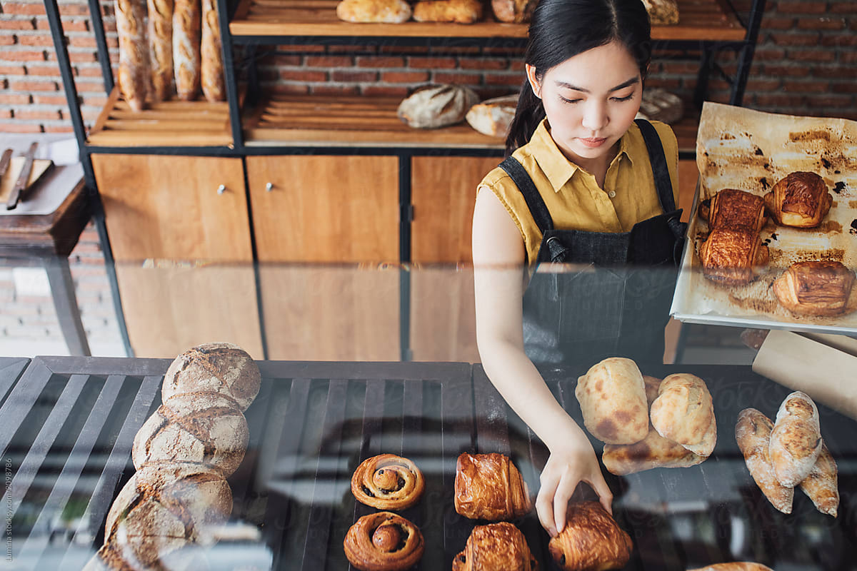  Pretty Thai Woman Working At Bakery By Stocksy Contributor Lumina 