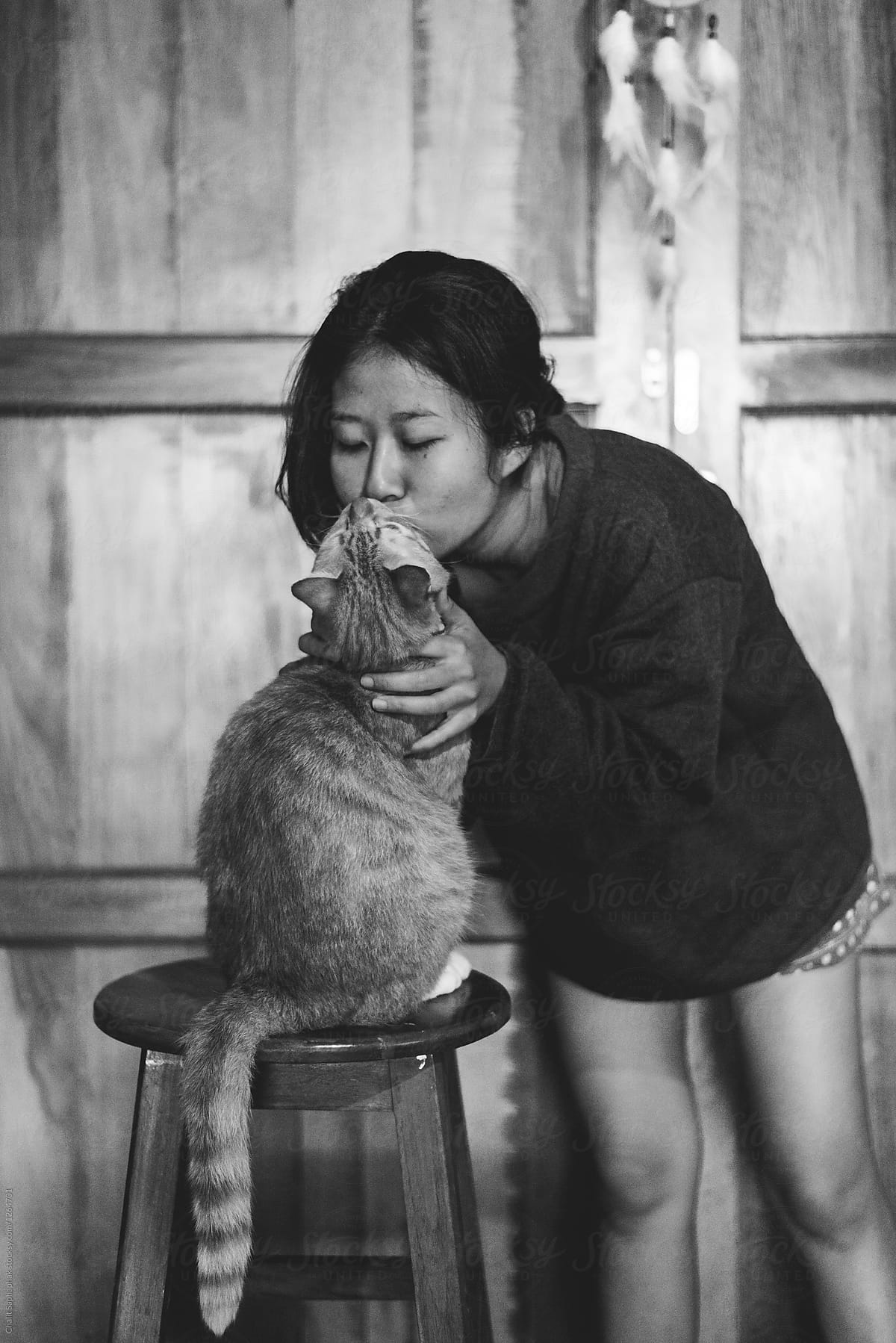 Asian woman and her cat.