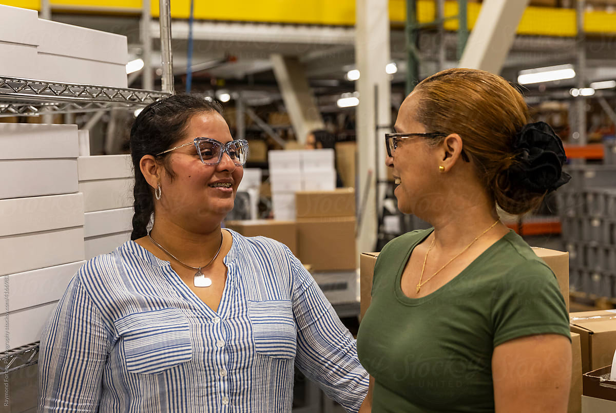 Portrait of smiling workers at warehouse job