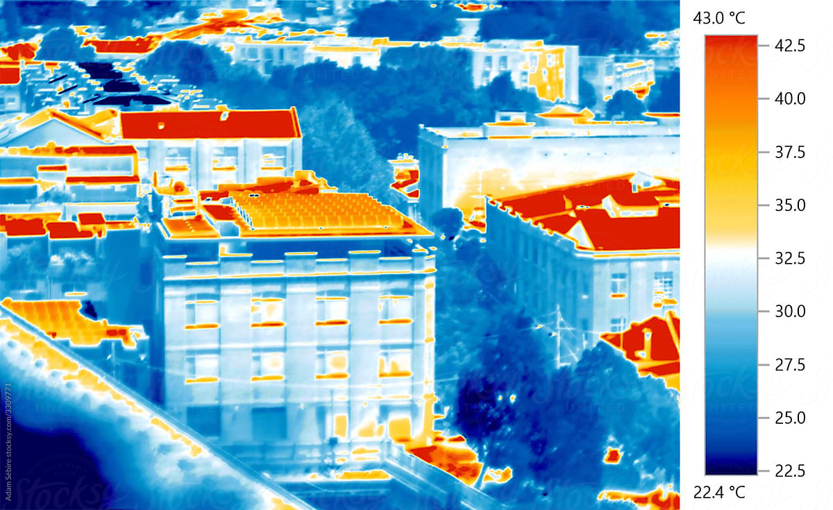 Solar panels on urban rooftop, thermal IR image of renewable photovoltaic technology