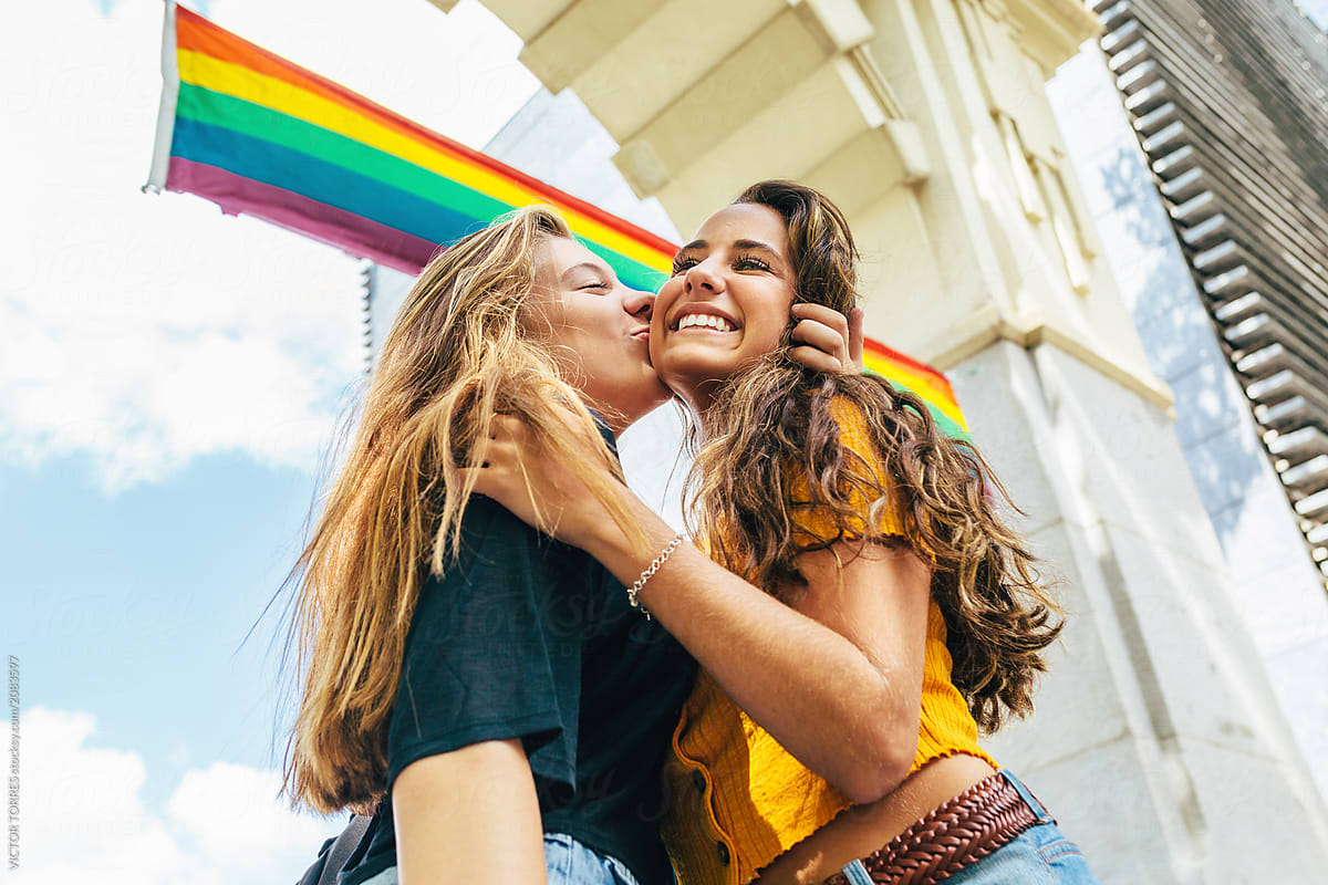 Teen Girls Kissing Under A Lgbt Flag By Victor Torres Teenager
