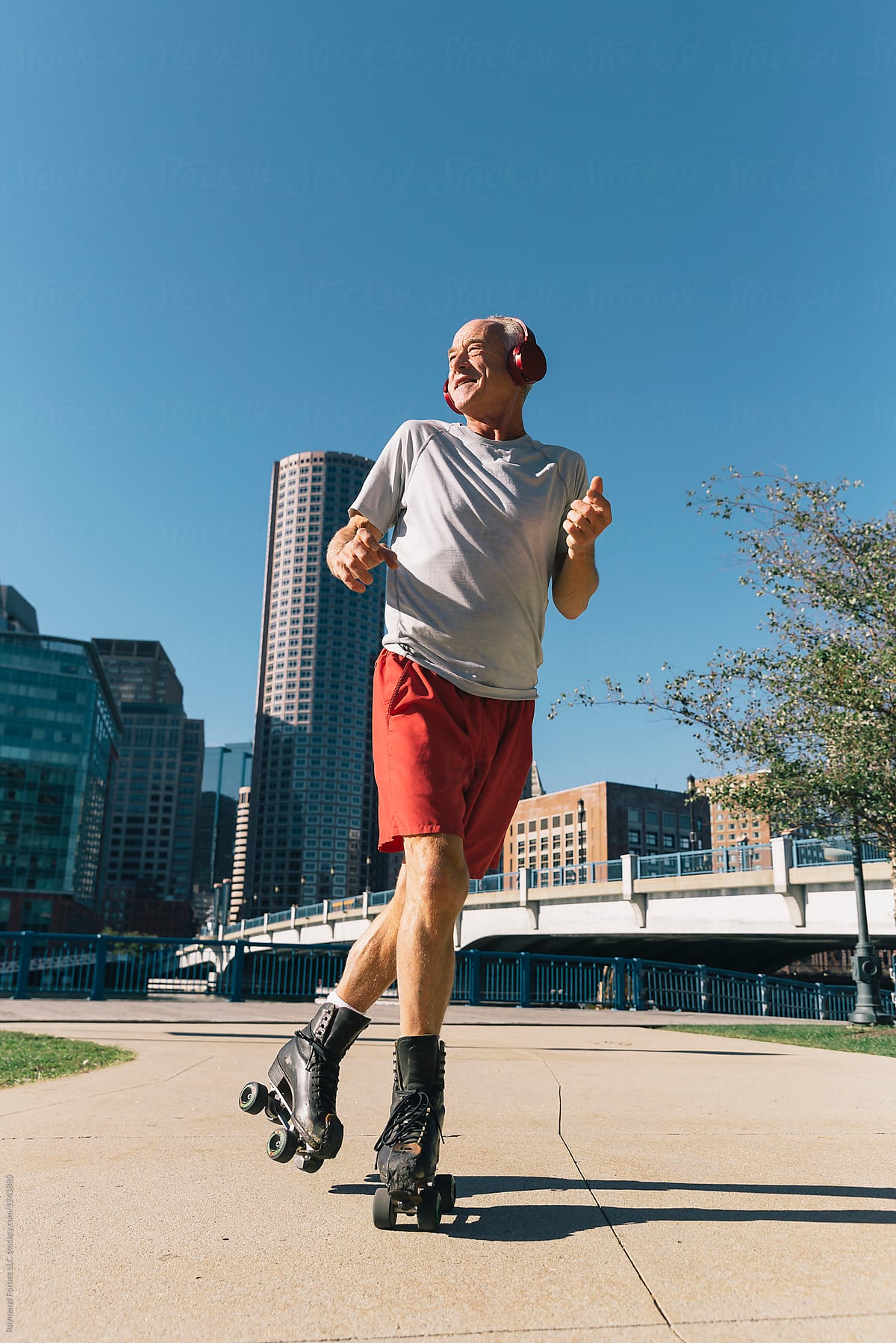 Active Senior Lifestyle Shot of Man on Roller Skates in City