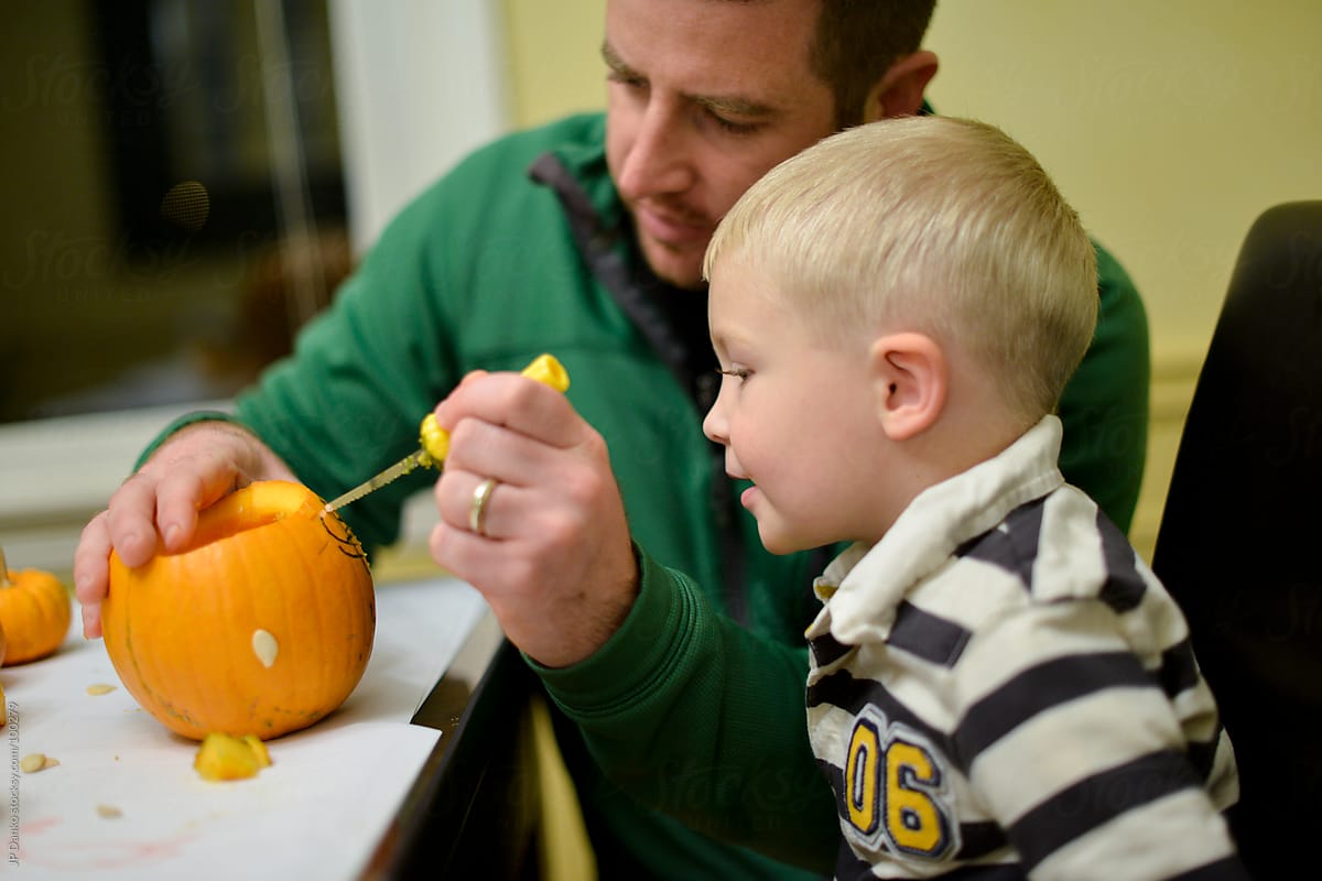 "Boy And Dad Halloween Pumpkin Carving" by Stocksy Contributor "JP ...