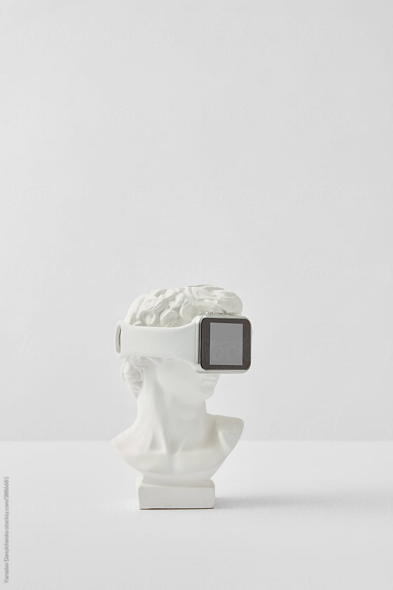 Smartwatch on head of white statue