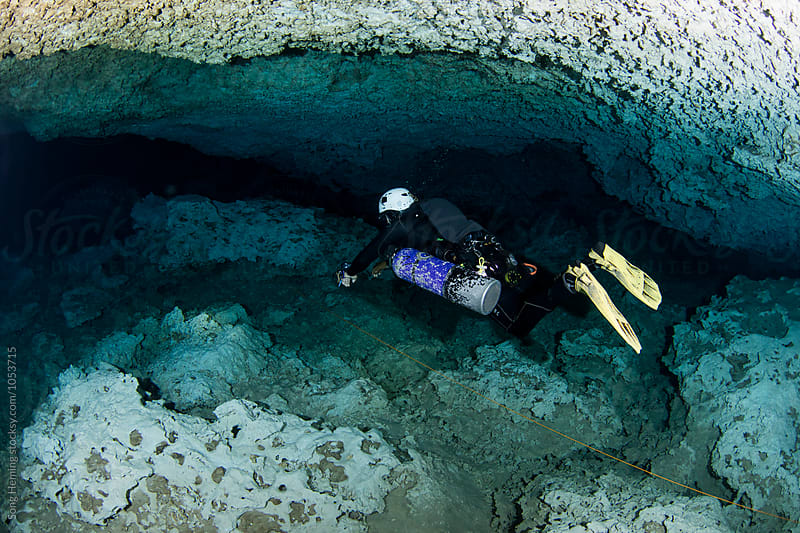 A scuba diver swimming in Mexico\'s  Cenote Chiken Ha
