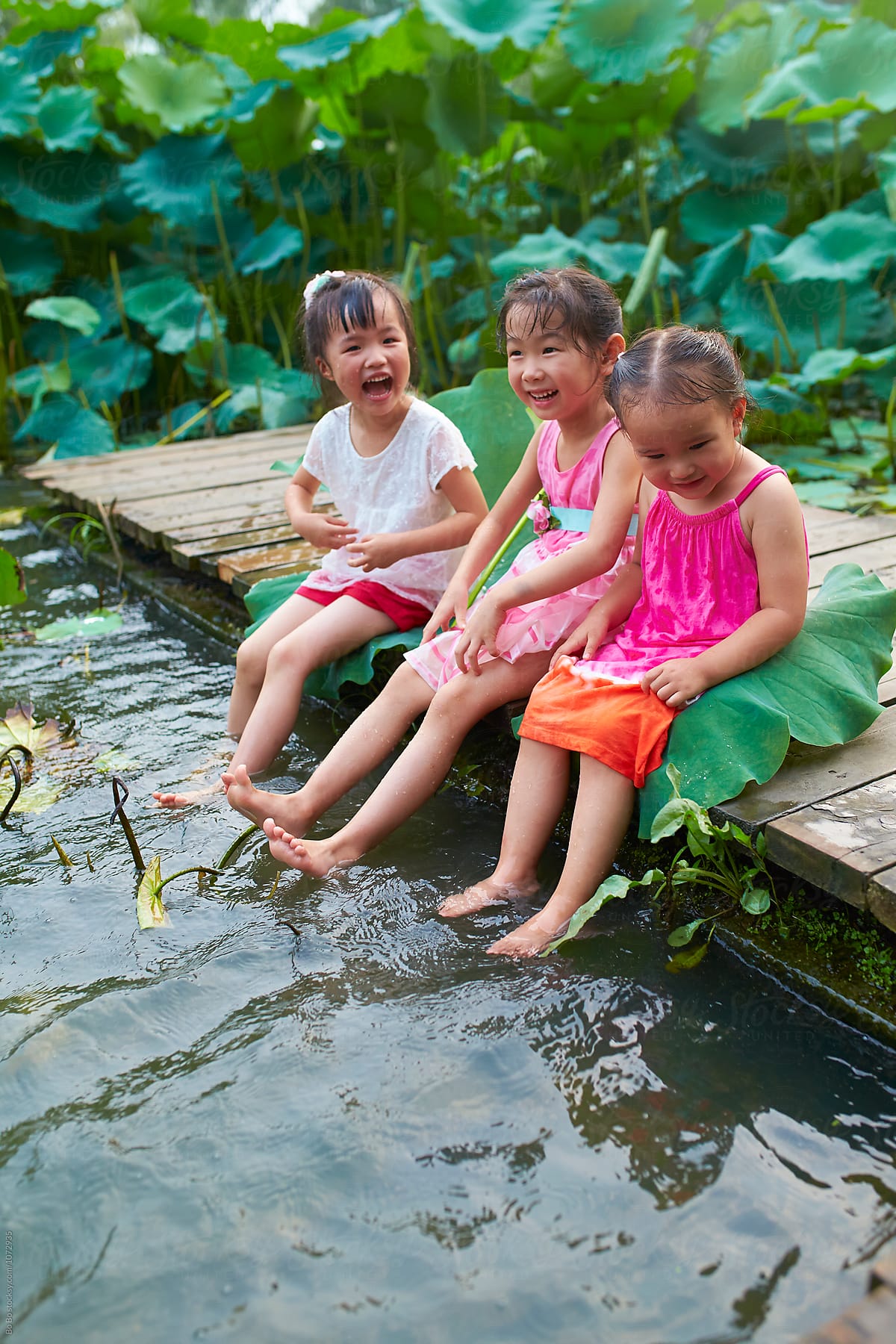 Happy childhood at summer pond side