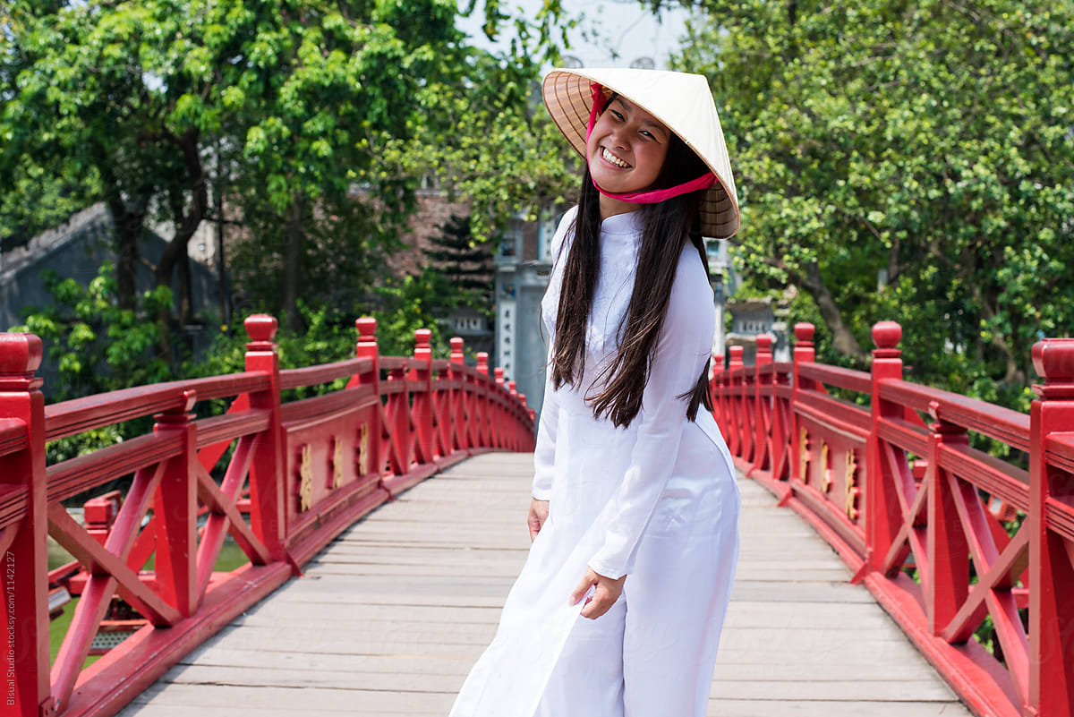 Vietnamese woman on oriental bridge