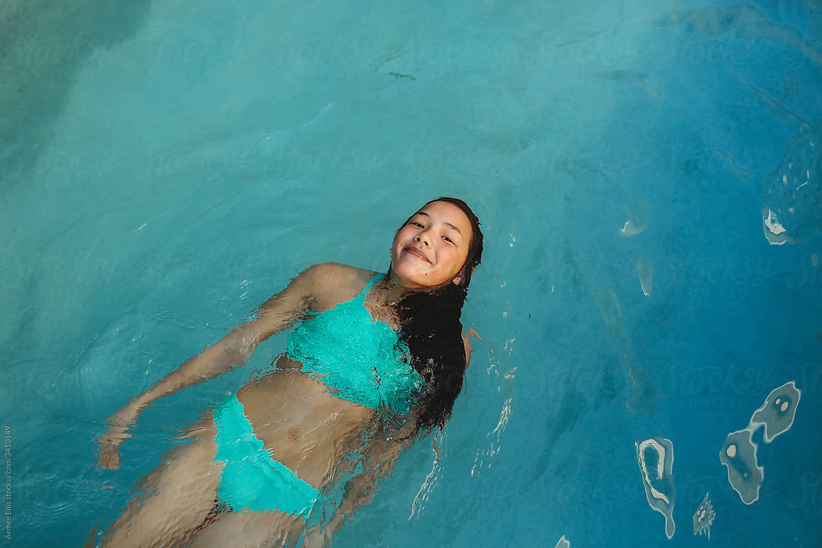 A girl floating in a pool