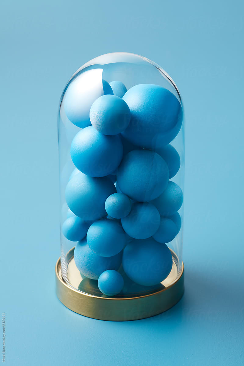 Creative arrangement of spheres under glass dome