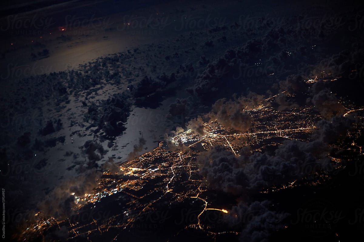 Dreamy high-altitude clouds and city scenes through airplane windows. During the journey