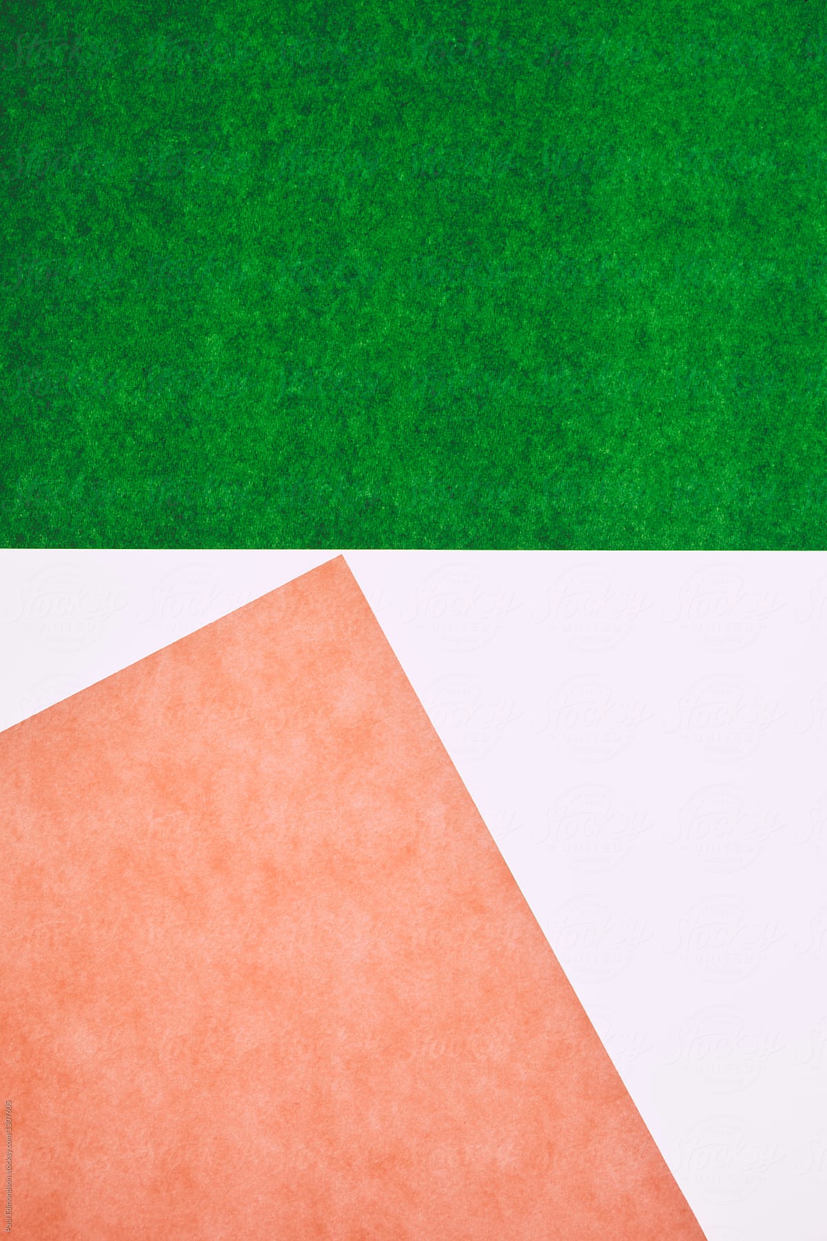 Detail of pink and green sheets of construction paper