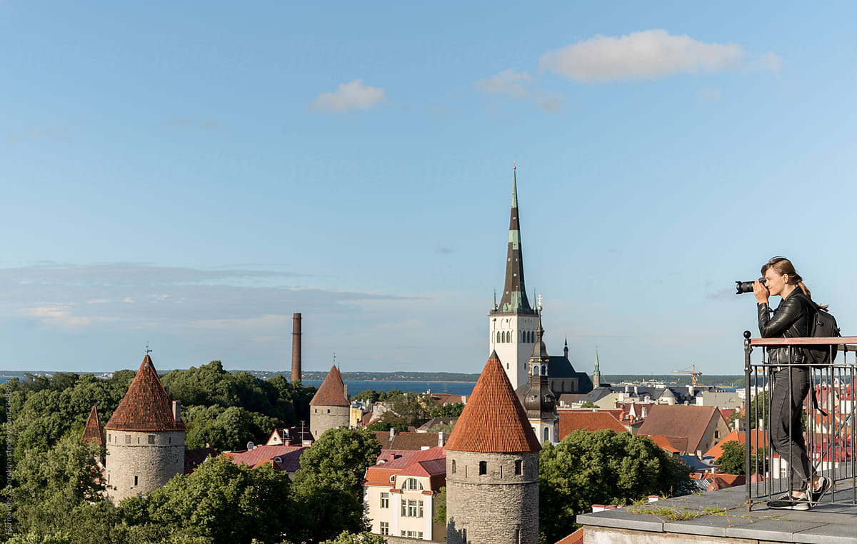 Photographer Taking Photo Of Tallinn Cityscape