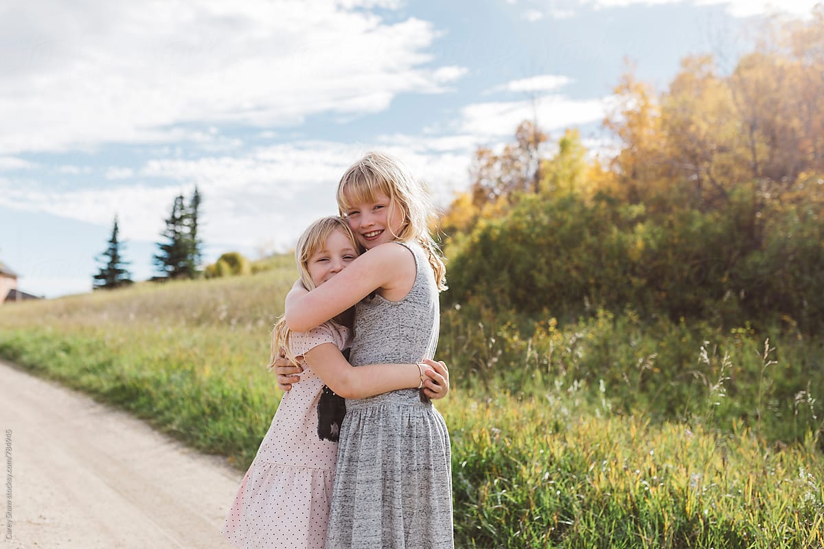 Young Sisters Hugging By Stocksy Contributor Carey Shaw Stocksy 