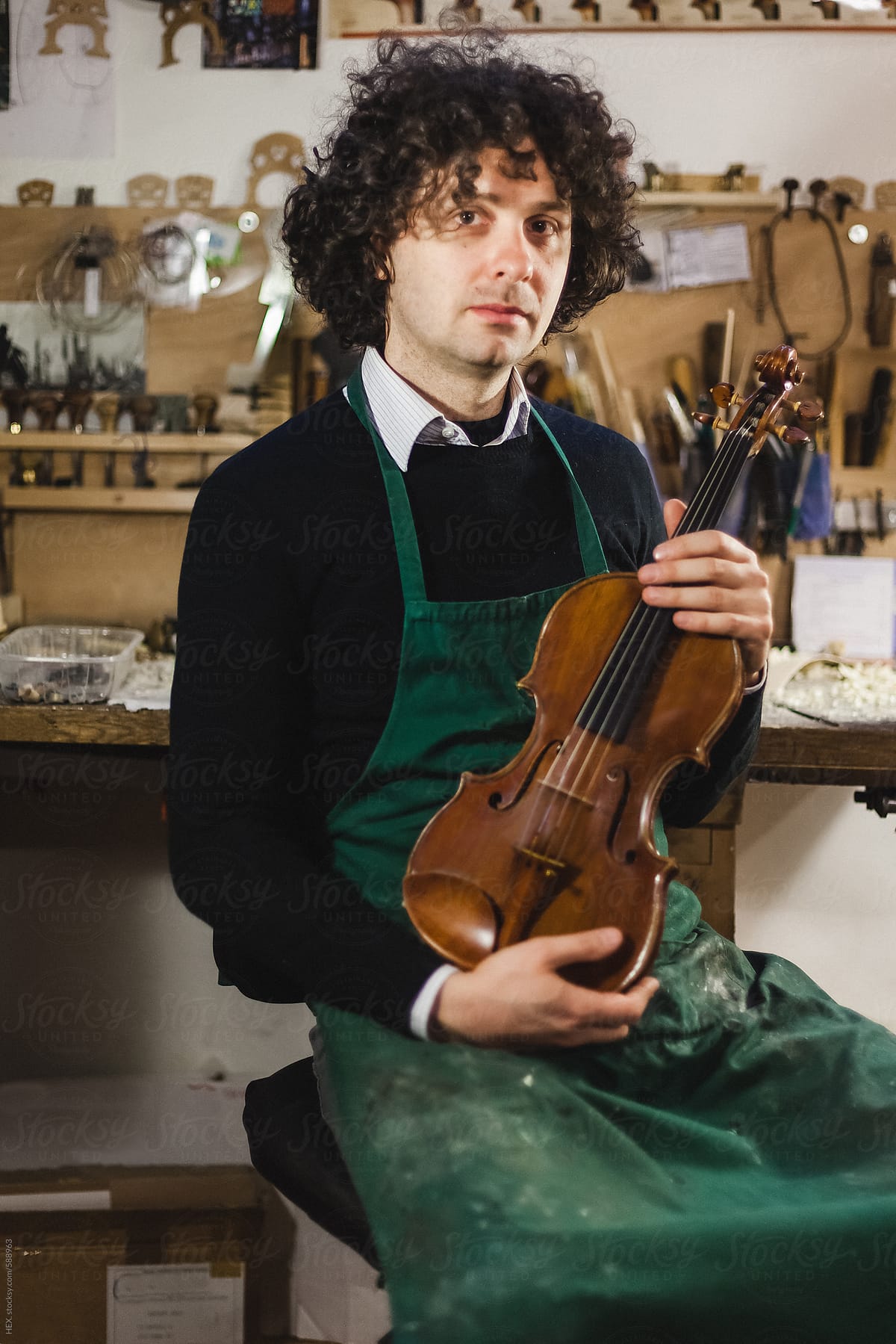 A Violin maker in his workshop.