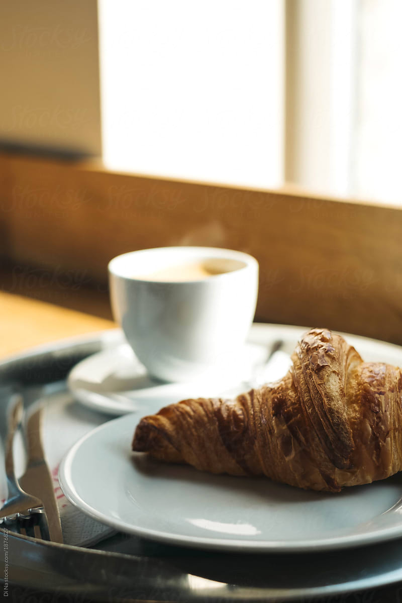 Croissant with fresh coffee