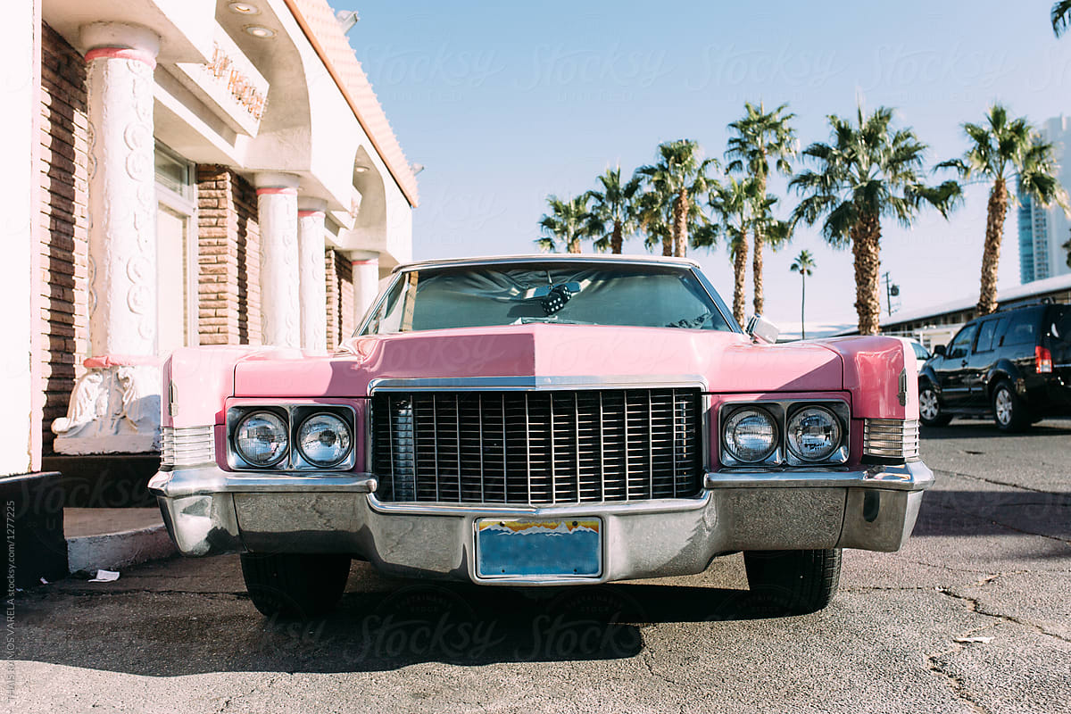 parked vintage pink car in las vegas seeing from the front