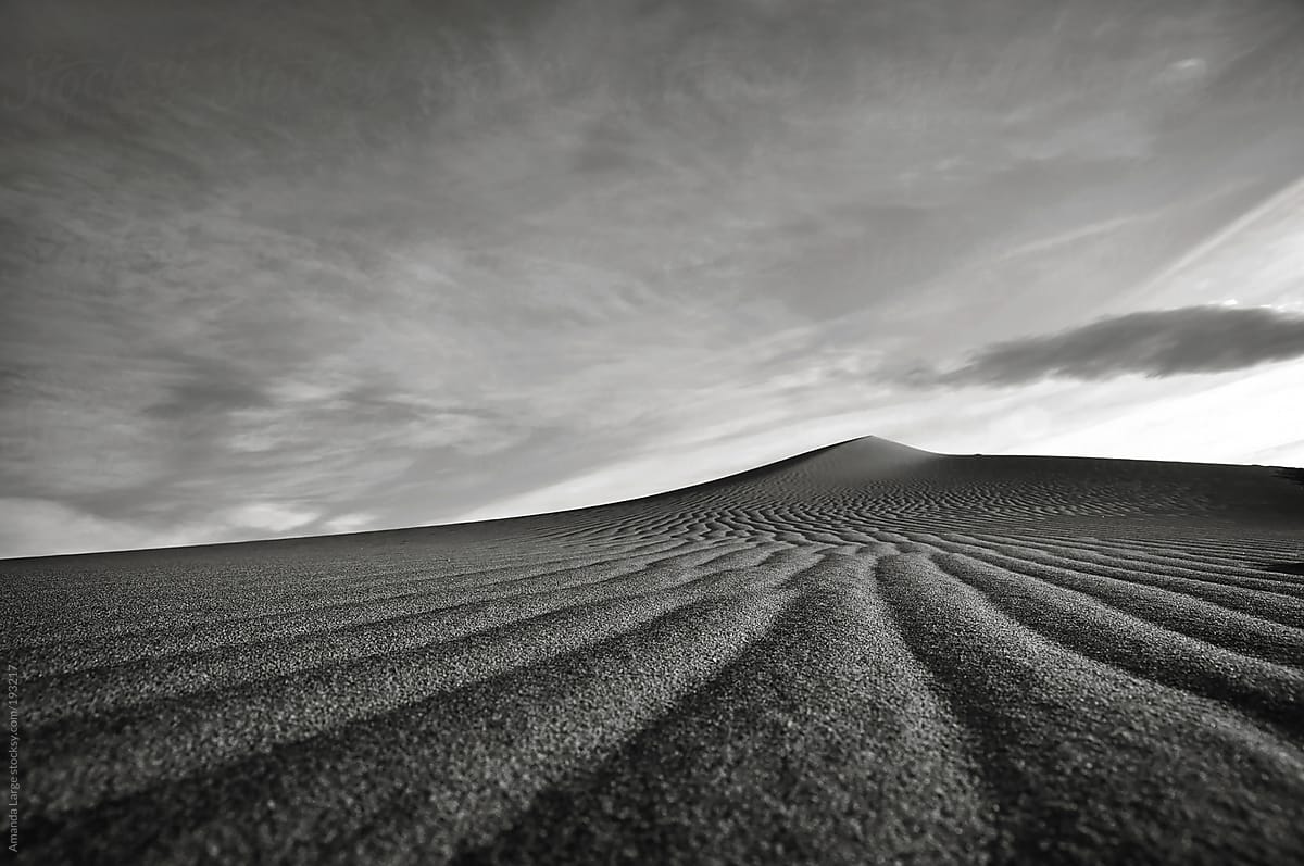 Black and white sand landscape of a sand dune.