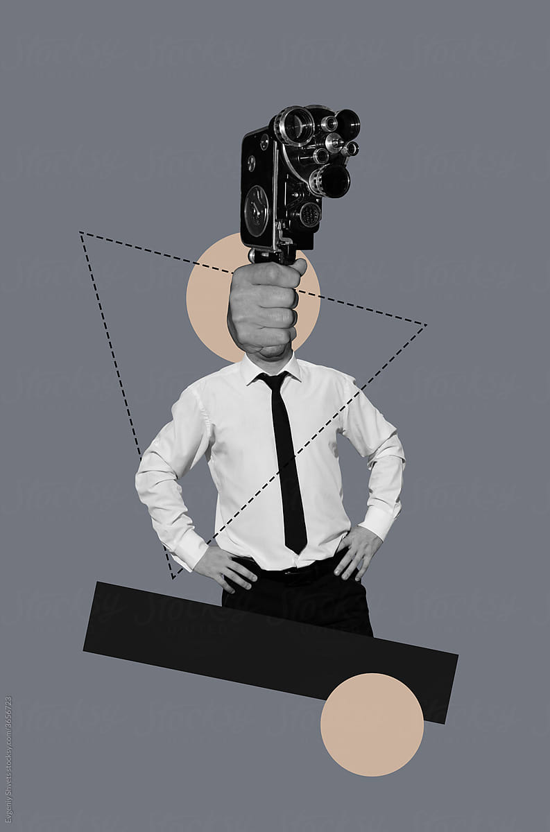 A man with a  movie camera instead of a head