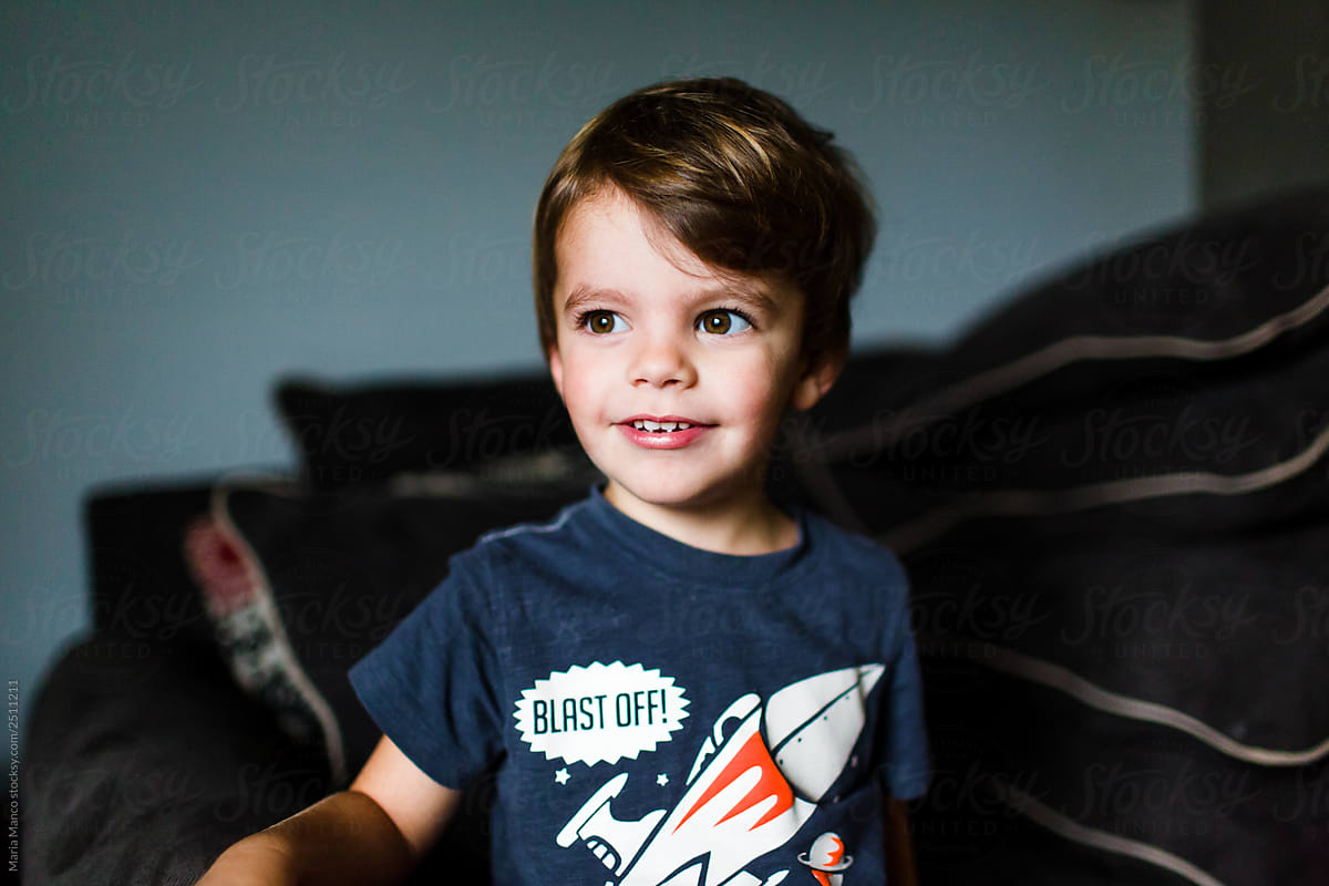portrait of boy in rocket shirt